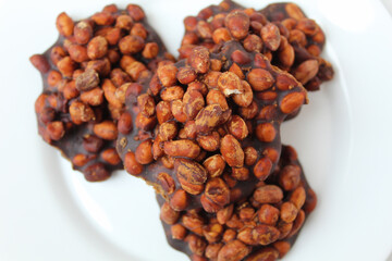 Gula kacang, is a traditional snack from Indonesia, made from roasted peanuts and brown sugar. Also...