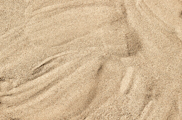 Obraz na płótnie Canvas sand beige on the beach background texture