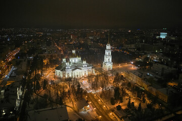 Fototapeta na wymiar Scenic aerial view of ancient orthodox Spassky cathedral in center of old historic touristic city Penza in Russian Federation. Beautiful winter look of old orthodox church in nighttime illumination