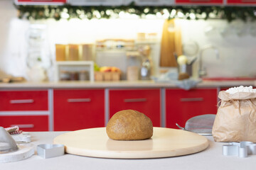 Christmas dough for gingerbread is on the table: flour, eggs, molds, butter. Preparation for culinary recipes of the dough