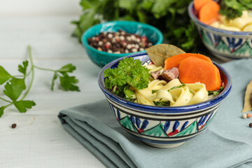 Lagman with turkey or beef . Close-up, on a light background with ingredients for cooking.