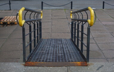 Gentle descent with metal handrails for people with disabilities