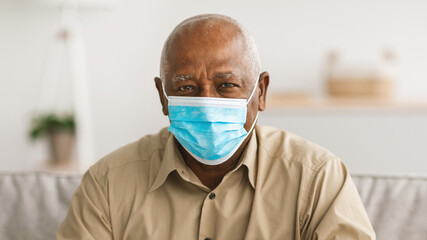 Senior African American Man Wearing Face Mask At Home, Panorama