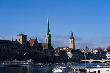 Women's Minster church and St. Peters Church at the old town of Z&uuml;rich on a blue cloudy autumn day. Photo taken November 21st, 2021, Zurich, Switzerland.
