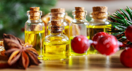 Christmas essential oils in a small bottle. Selective focus.