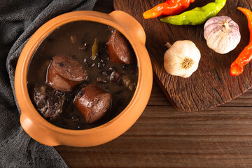 Feijoada typical Brazilian food. Traditional Brazilian food made with black beans. Top view. copy space