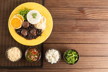 Feijoada typical Brazilian food. Traditional Brazilian food made with black beans. Top view. copy...