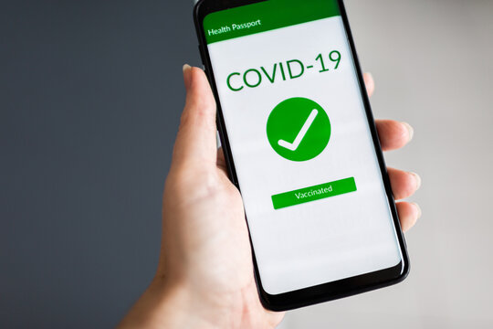 Phone displaying health passport fully vaccinated for covid-19
