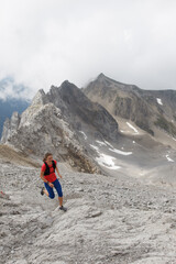 Fototapeta premium Women trail running in the European alps of Austria