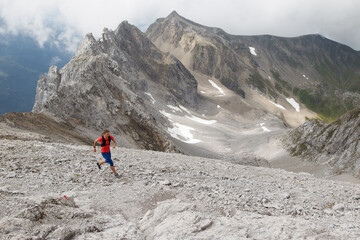 Naklejka premium Women trail running in the European alps of Austria