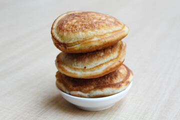 Kue Samir or Kamir or Khamir, traditional pancake from Pemalang, Indonesia. Wooden background. Side view.