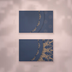 Business card in blue with Indian brown ornaments for your personality.