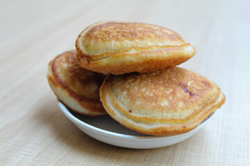 Kue Samir or Kamir or Khamir, traditional pancake from Pemalang, Indonesia. Wooden background.
