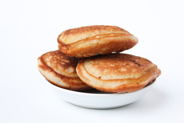 Kue Samir or Kamir or Khamir, traditional pancake from Pemalang, Indonesia. Isolated on whte background. Side view.