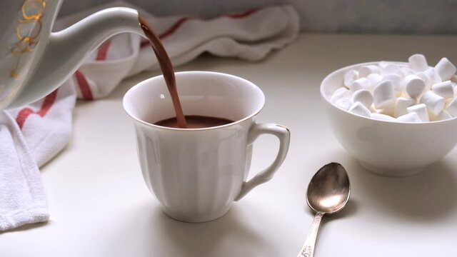 
Ceramic mug with hot chocolate cocoa drink with marshmallow