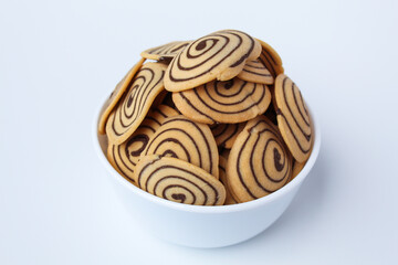 Kue Kuping Gajah, traditional cookies from Indonesia. Sweet and crunchy, unique spiral pattern. Isolated in white background.