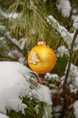 Christmas tree toy on coniferous branches