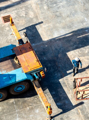 View from the top floor of the industrial plant directly above of truck crane