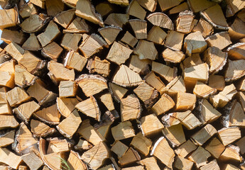 Woodpile.Split birch firewood for kindling and heating the house in winter.