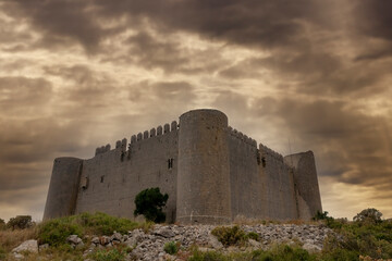 Fototapeta na wymiar montgri castle a cloudy sunset