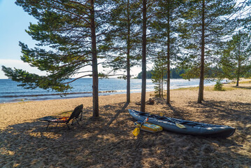 Kayak on the sandy shore of Lake Ladoga. Vidlitsa. Karelia.