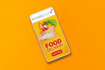 Mobile phone with online application about fast food delivery and text isolated on orange background, top view