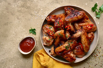 Grilled spicy chicken wings. Top view with copy spase.