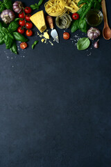 Culinary background with traditional  ingredients of italian cuisine : pasta, tomatoes, garlic,...