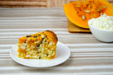 Rustic still life. Pumpkin curd pie, pumpkin slices and homemade cottage cheese in a white bowl.