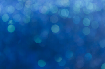 abstract blue bokeh glitter sparkle background.