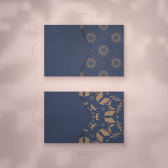 Business card in blue with vintage brown pattern for your contacts.