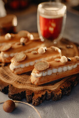 Homemade cakes, dessert eclair with cream and edible decor