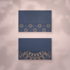 Business card template in blue with a luxurious brown pattern for your contacts.