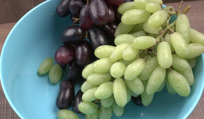 Natural organic different types of fresh ripe juicy grapes and space for text on table. top view, Agriculture concepts.