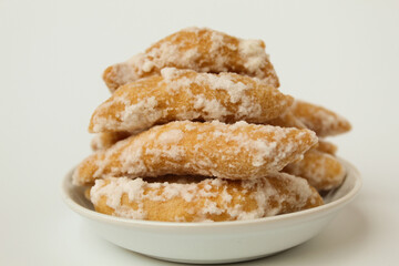 Widaran manis, also called telur gabus manis. Indonesian traditional snack. Fried dough then glazed with melted sugar. Isolated on white background.
