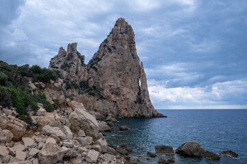Pedra Longa in Sardinia Italy. Rocky shore by the ocean. Rocky beach during dusk. 
