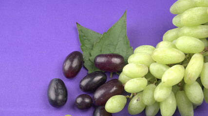 Natural organic different types of fresh ripe juicy grapes and space for text on table. top view, Agriculture concepts.