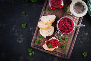 Vegetarian food. Jar with beetroot pate. Healthy eating. Sandwiches with beetroot and walnut pate....