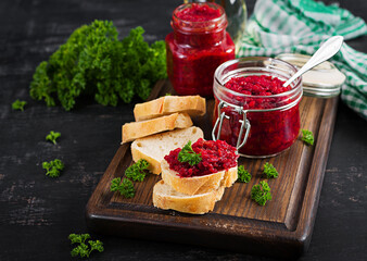 Vegetarian food. Jar with beetroot pate. Healthy eating. Sandwiches with beetroot and walnut pate.