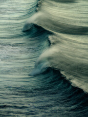 Big blue waves crashing ashore