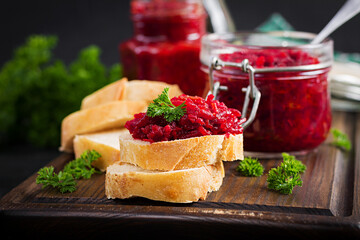 Vegetarian food. Jar with beetroot pate. Healthy eating. Sandwiches with beetroot and walnut pate.