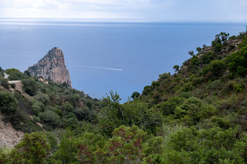 Pedra Longa in Sardinia Italy. Rocky shore by the ocean. Rocky beach during dusk. 