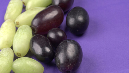 Natural organic different types of fresh ripe juicy grapes and space for text on table. top view, Agriculture concepts.