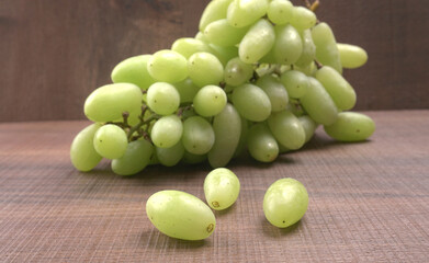 Natural organic different types of fresh ripe juicy grapes and space for text on table. top view, Agriculture concepts.