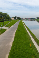 Walking path by the river, no people.