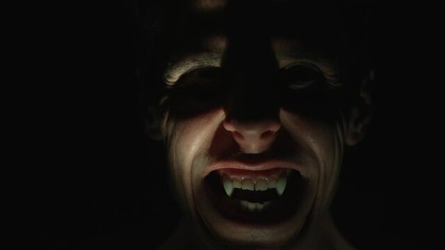 Angry vampire in the dark