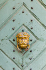 Old door with an interesting ornament, close-up.