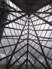 Fototapeta premium metal structure of a building for giant windows, seen from the inside