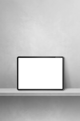 Digital tablet pc on grey wall shelf. Vertical background banner