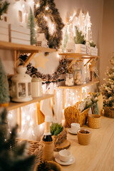 side view. Christmas decor. garlands on decorated in kitchen for new year. 